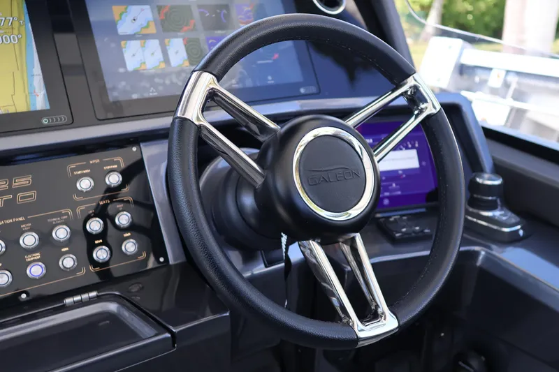 Slide: The Image of Control panel of 2024 Galeon 325 GTO yacht with various buttons and navigation display. - 36