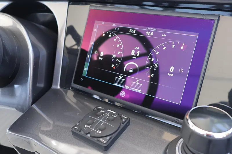 Slide: The Image of 2024 Galeon 325 GTO helm with advanced navigation controls and sleek steering wheel design. - 37