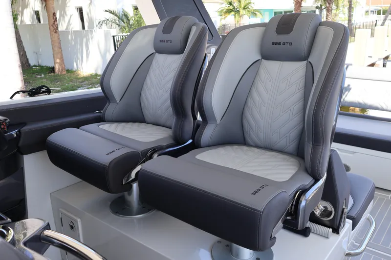 Slide: The Image of 2024 Galeon 325 GTO boat dashboard with Raymarine controls and water alarm system. - 44