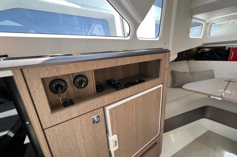 Slide: The Image of 2024 Galeon 325 GTO cabin interior with cozy seating and cushions. - 53