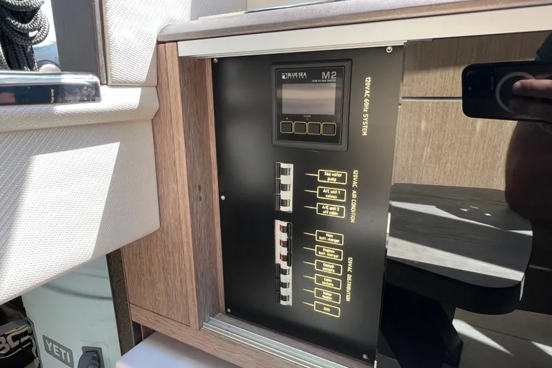 Slide: The Image of 2024 Galeon 325 GTO interior with modern cabinetry and large windows. - 56