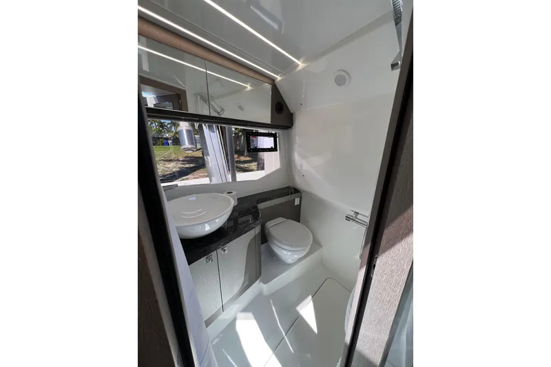 Slide: The Image of Manufacturer Provided Image: 2024 Galeon 325 GTO cabin interior with modern lighting and cozy bedding. - 63