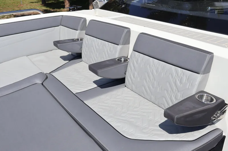 Slide: The Image of Luxurious seating on the 2024 Galeon 325 GTO boat, featuring sleek gray upholstery. - 73