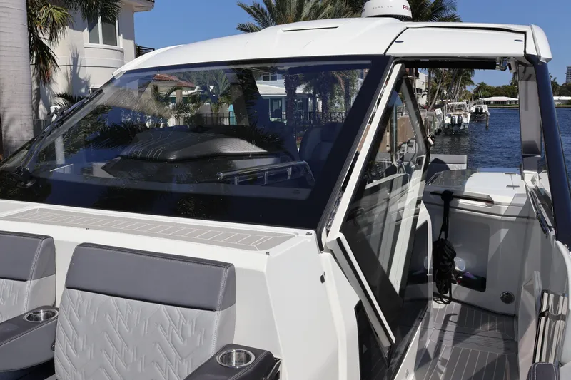 Slide: The Image of 2024 Galeon 325 GTO logo on luxury boat interior with tropical background. - 75