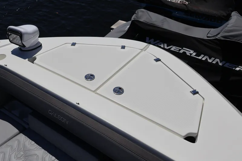 Slide: The Image of 2024 Galeon 325 GTO boat with sleek design, docked near waterfront homes. - 79