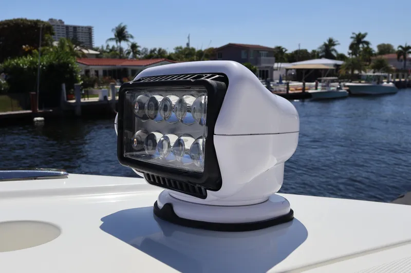 Slide: The Image of 2024 Galeon 325 GTO boat storage compartments open on deck by the water. - 81