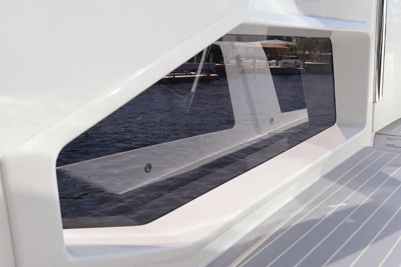 Slide: The Image of 2024 Galeon 325 GTO spotlight on deck, with waterfront view in background. - 82