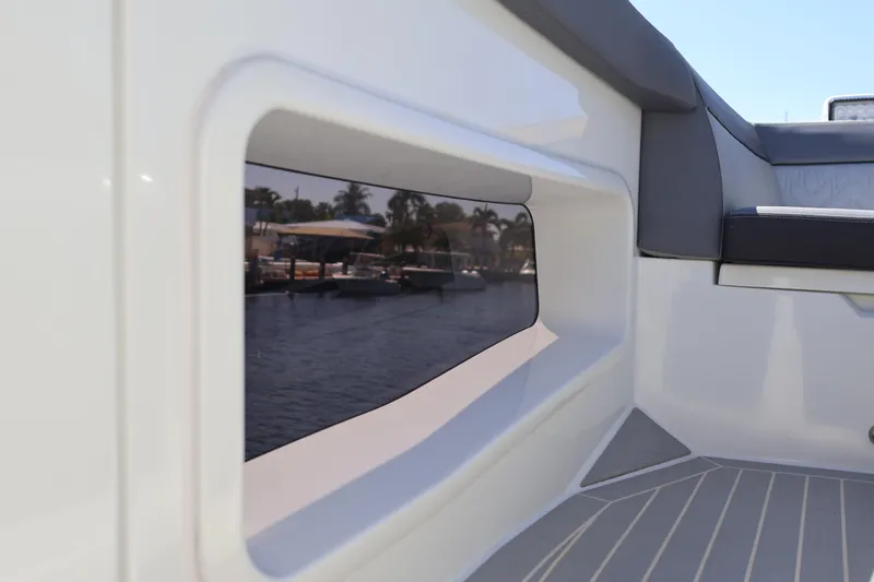 Slide: The Image of 2024 Galeon 325 GTO yacht window reflecting marina view. - 83