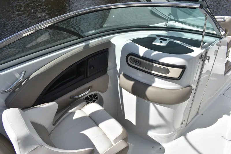 Slide: The Image of 2019 Crownline Eclipse E255 SURF boat interior with white seating and sleek dashboard design. - 12