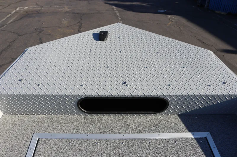 Slide: The Image of Bow of 2026 Smoker Craft Pro Sportsman 1660 with diamond plate finish. - 12