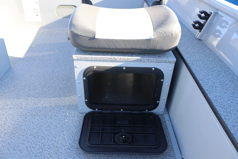 Slide: The Image of 2026 Smoker Craft Pro Sportsman 1660 boat seat with storage compartment open. - 14