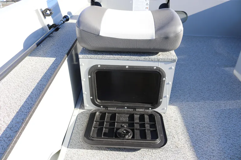 Slide: The Image of 2026 Smoker Craft Pro Sportsman 1660 boat seat with storage compartment open. - 18