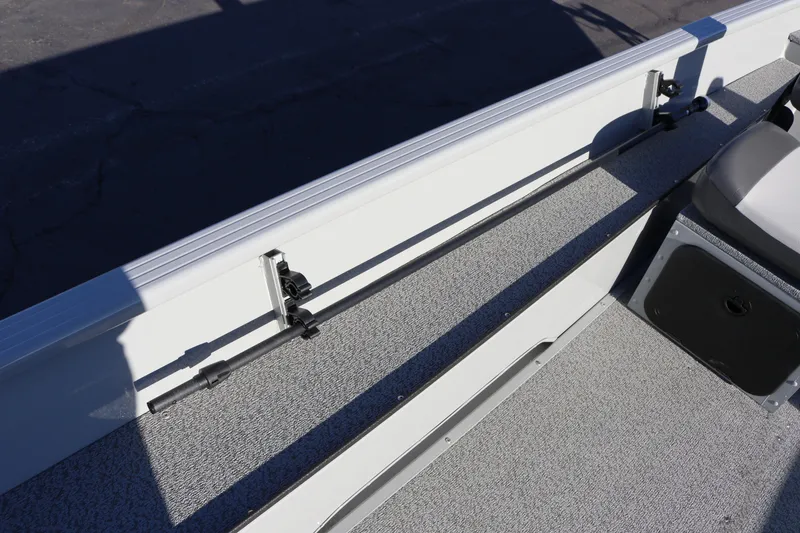 Slide: The Image of 2026 Smoker Craft Pro Sportsman 1660 boat interior with rod holder and seating. - 21