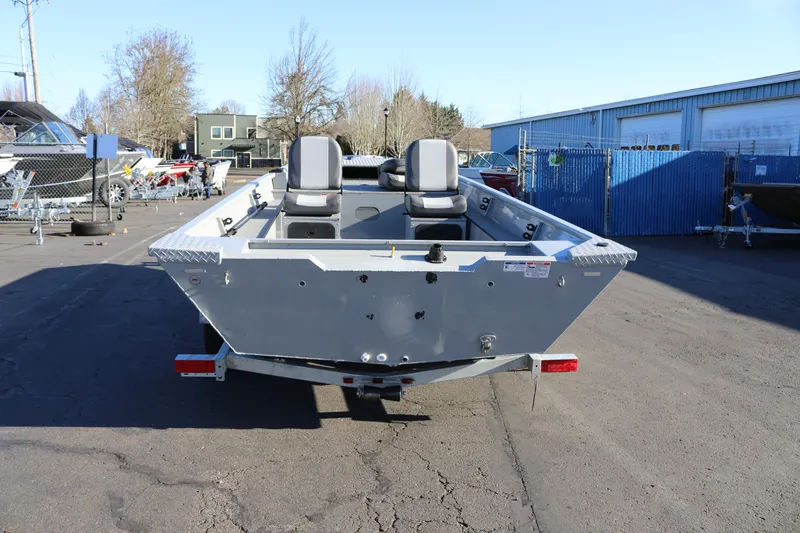 Slide: The Image of 2026 Smoker Craft Pro Sportsman 1660 boat on trailer in outdoor lot. - 28