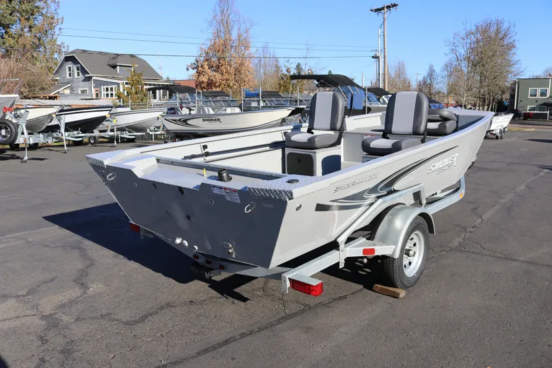 Slide: The Image of 2026 Smoker Craft Pro Sportsman 1660 boat on trailer in outdoor showroom. - 5