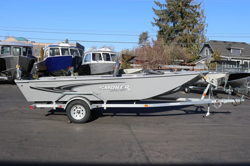Slide: The Image of 2026 Smoker Craft Pro Sportsman 1660 boat on trailer, parked outdoors. - 6