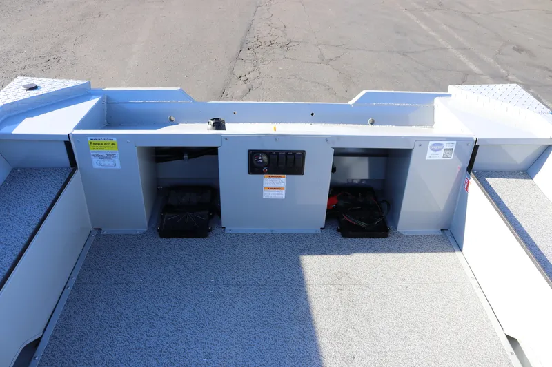 Slide: The Image of 2026 Smoker Craft Pro Sportsman 1660 boat interior with storage compartments. - 8