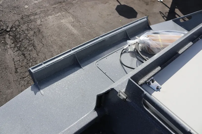 Slide: The Image of 2026 KingFisher 2825 Coastal Express boat deck with equipment and storage compartments. - 14