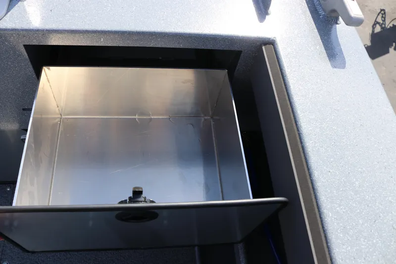 Slide: The Image of Open storage compartment on 2026 KingFisher 2825 Coastal Express boat. - 19