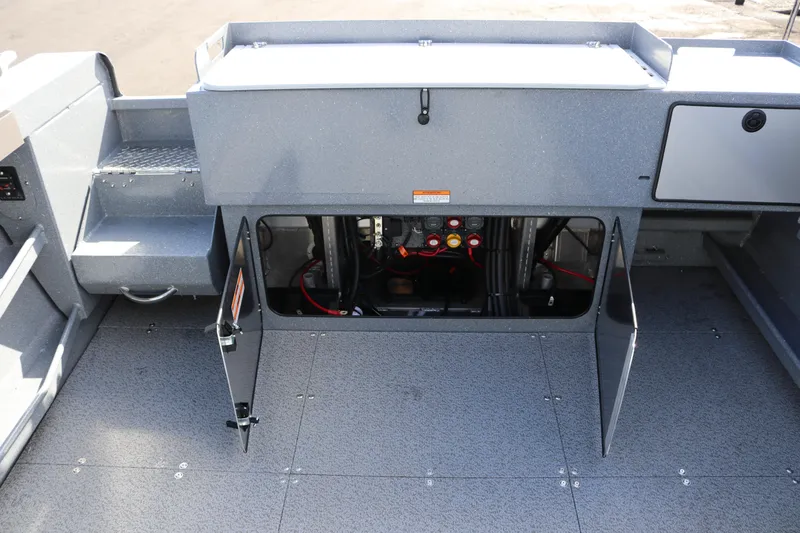 Slide: The Image of 2026 KingFisher 2825 Coastal Express boat interior with open storage compartment. - 20