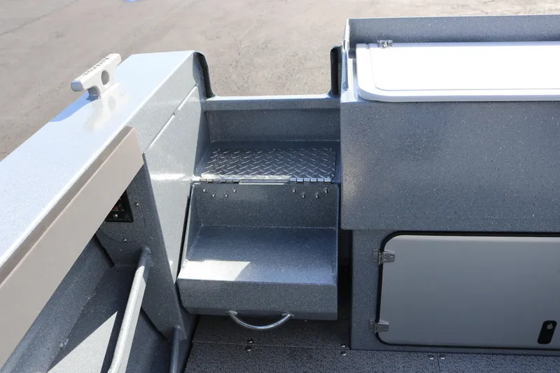 Slide: The Image of Interior view of 2026 KingFisher 2825 Coastal Express boat, featuring a step and storage compartment. - 21