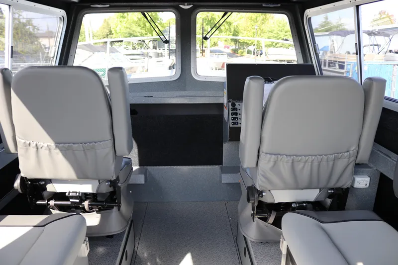 Slide: The Image of Interior of 2026 KingFisher 2825 Coastal Express boat with two gray seats. - 24