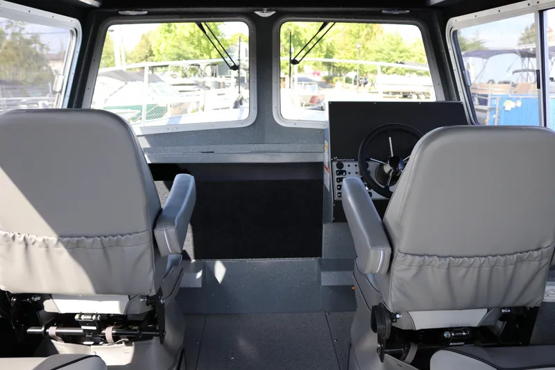 Slide: The Image of Interior of 2026 KingFisher 2825 Coastal Express boat with dual captain seats. - 26
