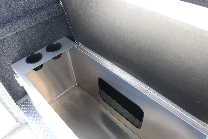 Slide: The Image of Storage compartment in 2026 KingFisher 2825 Coastal Express boat with cup holders. - 28