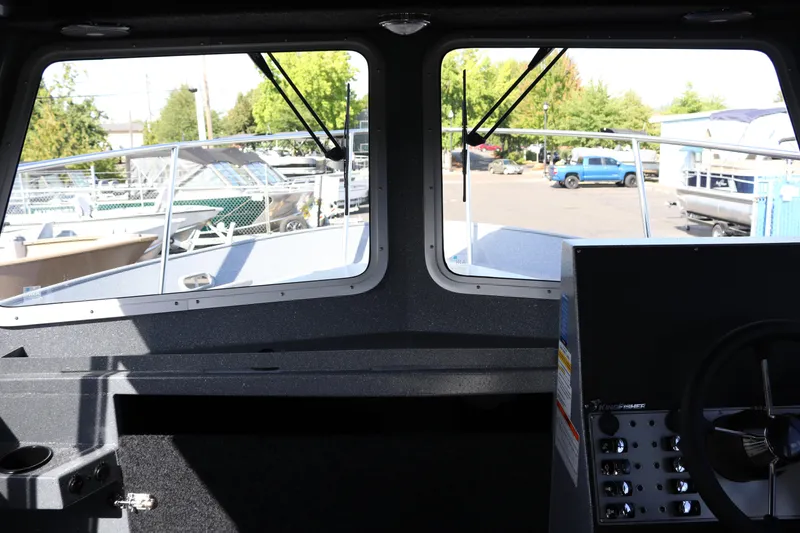 Slide: The Image of Interior view of 2026 KingFisher 2825 Coastal Express boat cockpit with steering wheel. - 32