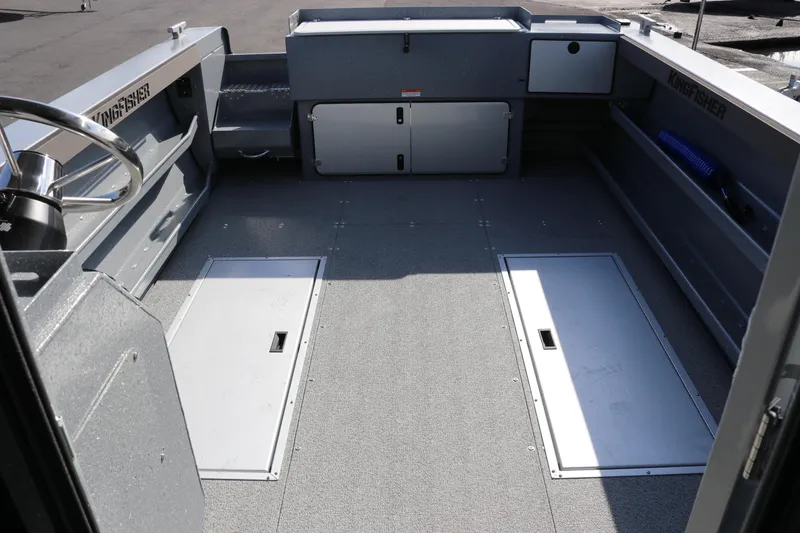 Slide: The Image of Interior view of 2026 KingFisher 2825 Coastal Express boat, showcasing spacious deck layout. - 44