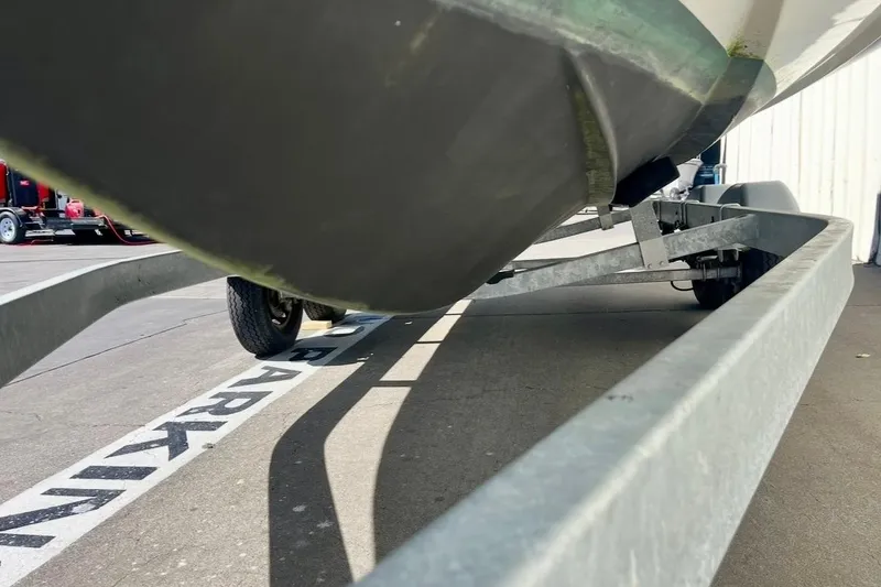 Slide: The Image of 2024 Zodiac Medline 6.8 boat on trailer, parked in designated area. - 3