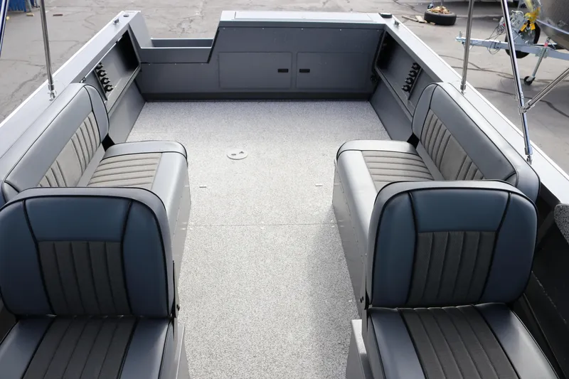 Slide: The Image of 2026 Alumaweld Intruder Outboard 20 boat interior with gray seating and spacious layout. - 10