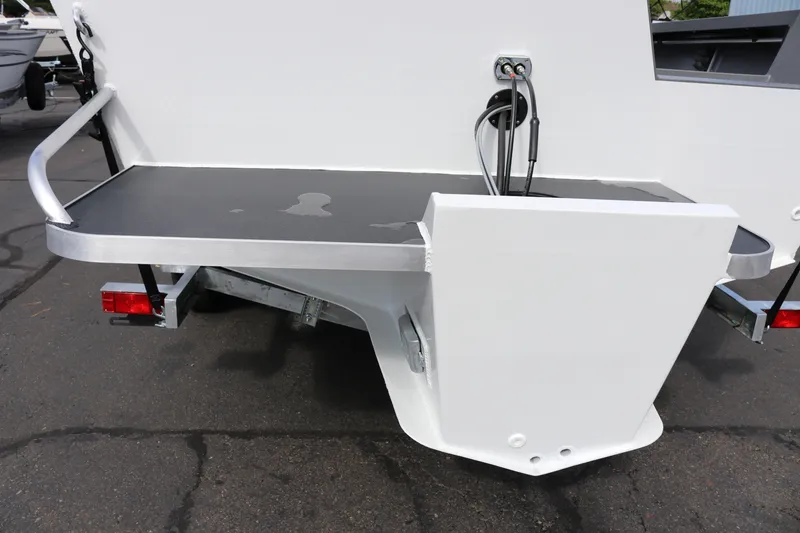 Slide: The Image of 2026 Alumaweld Intruder Outboard 20 boat stern with trailer attachment. - 11