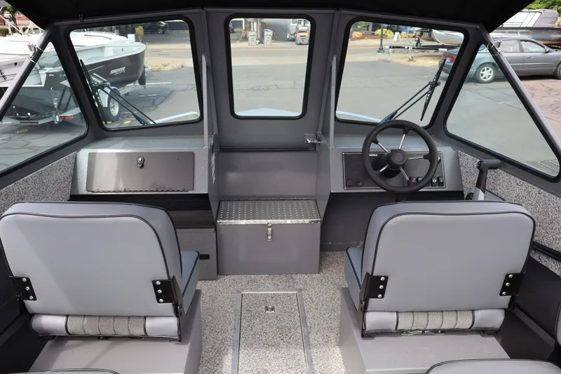 Slide: The Image of Interior of 2026 Alumaweld Intruder Outboard 20 boat with dual seats and steering wheel. - 16