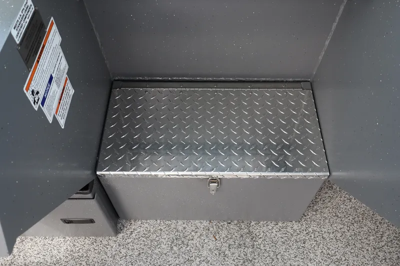 Slide: The Image of Alumaweld Intruder Outboard 20 (2026) diamond plate storage box in boat interior. - 22