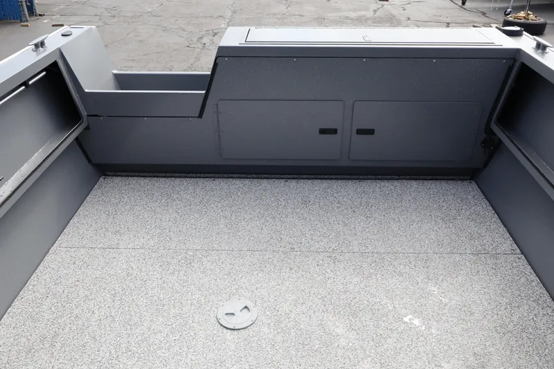 Slide: The Image of 2026 Alumaweld Intruder Outboard 20 boat interior with spacious, durable flooring and storage compartments. - 30