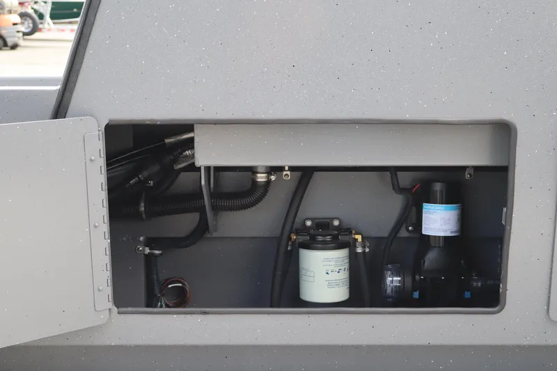 Slide: The Image of 2026 Alumaweld Intruder Outboard 20 engine compartment showcasing internal components and wiring. - 36