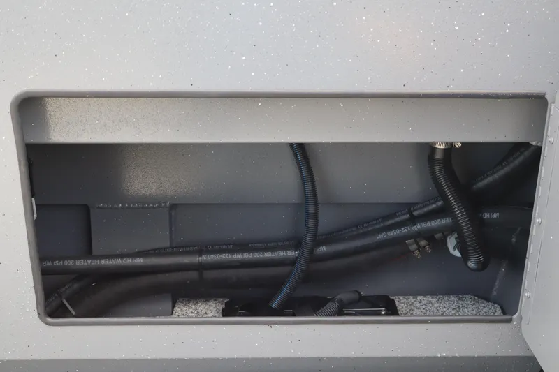 Slide: The Image of Interior view of 2026 Alumaweld Intruder Outboard 20 boat showing wiring and hoses. - 37