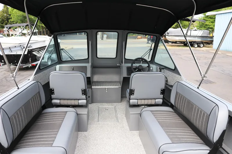 Slide: The Image of 2026 Alumaweld Intruder Outboard 20 interior with seating and steering wheel. - 39