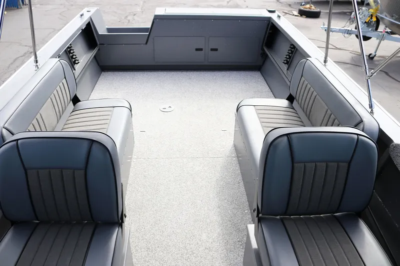 Slide: The Image of 2026 Alumaweld Intruder Outboard 20 boat interior with gray seating and spacious layout. - 40