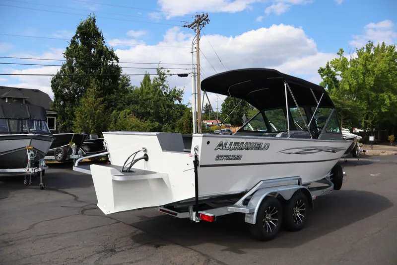 Slide: The Image of 2026 Alumaweld Intruder Outboard 20 boat on trailer, parked outdoors. - 41