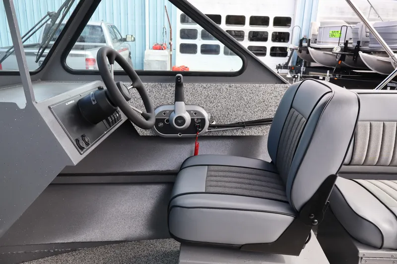 Slide: The Image of Interior of 2026 Alumaweld Intruder Outboard 20 boat with steering wheel and seating. - 43