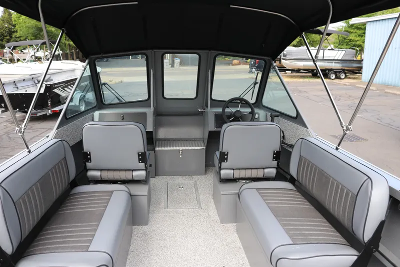 Slide: The Image of 2026 Alumaweld Intruder Outboard 20 interior with seating and steering wheel. - 5