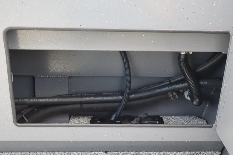 Slide: The Image of 2026 Alumaweld Intruder Outboard 20 boat interior wiring and tubing detail. - 8