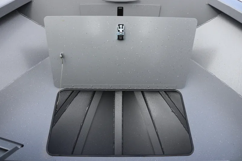 Slide: The Image of 2026 Alumaweld Intruder Outboard 20 boat interior with open storage compartment. - 9