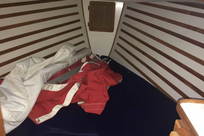 Slide: The Image of Interior cabin of 1997 Com Pac 27-2 sailboat with folded sails. - 7