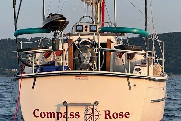 Slide: The Image of Sailboat "Compass Rose" on water, Com Pac 27-2, 1997 model, rear view. - 9