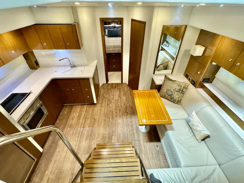 Slide: The Image of Interior of 2016 Cruisers Yachts 48 Cantius with modern kitchen and seating. - 11