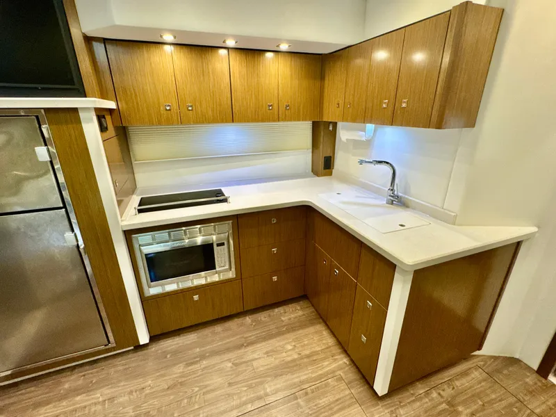 Slide: The Image of Modern kitchen in a 2016 Cruisers Yachts 48 Cantius. - 15