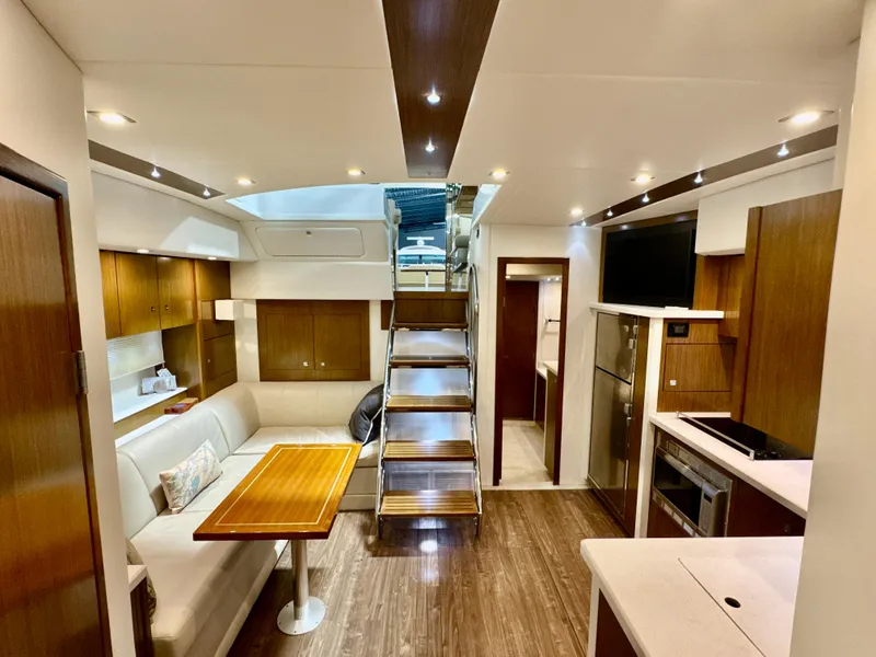 Slide: The Image of Interior of 2016 Cruisers Yachts 48 Cantius with modern kitchen and dining area. - 18